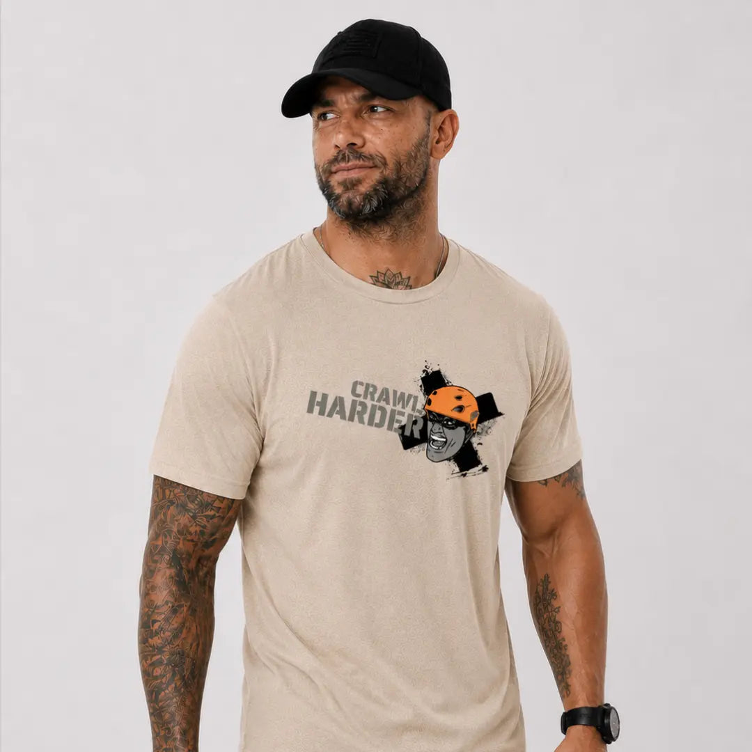 man in hat wearing sand axel off road shirt that reads crawl harder
