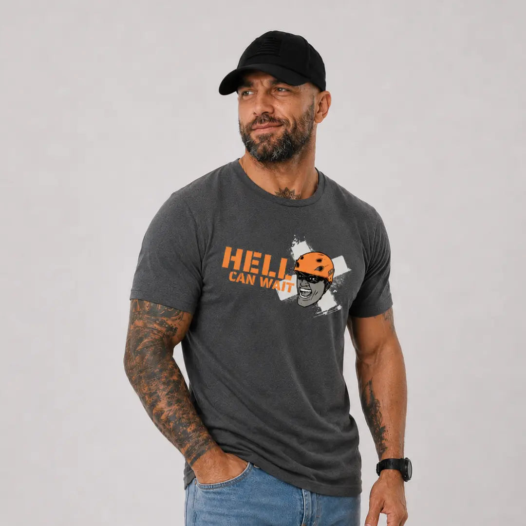 man in hat wearing gray axel off road shirt that reads hell can wait