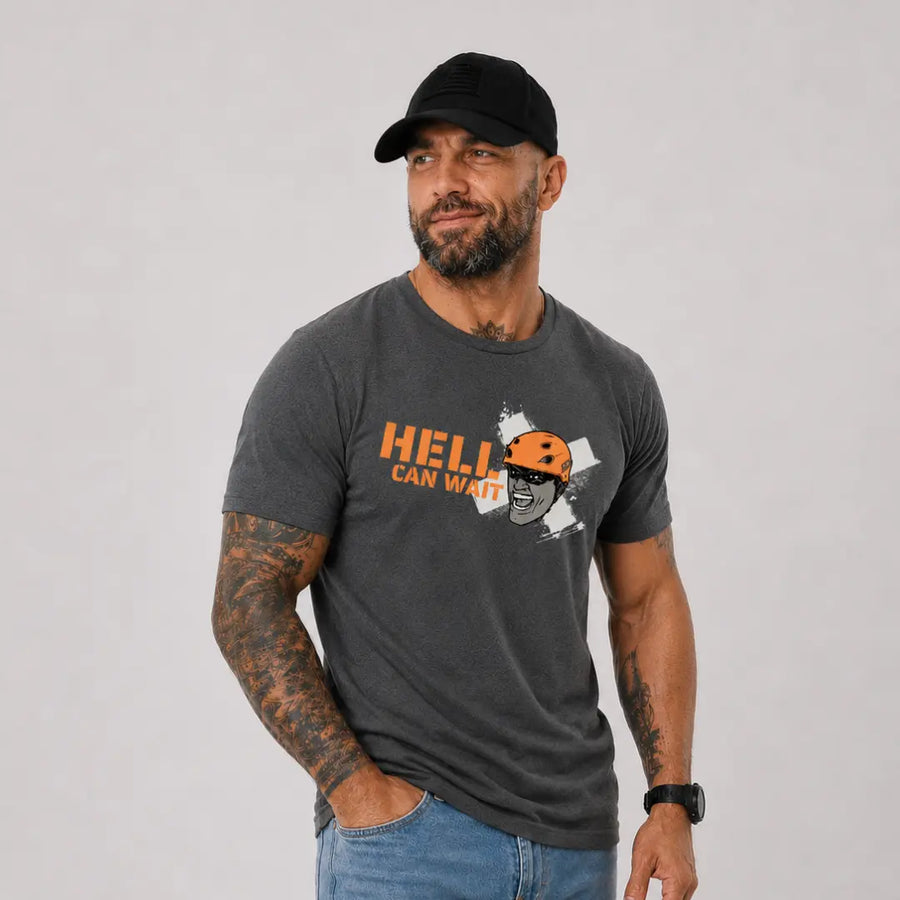 man in hat wearing gray axel off road shirt that reads hell can wait